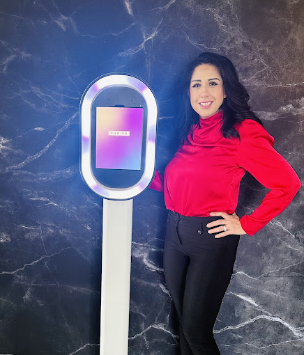 A woman standing next to a parking meter